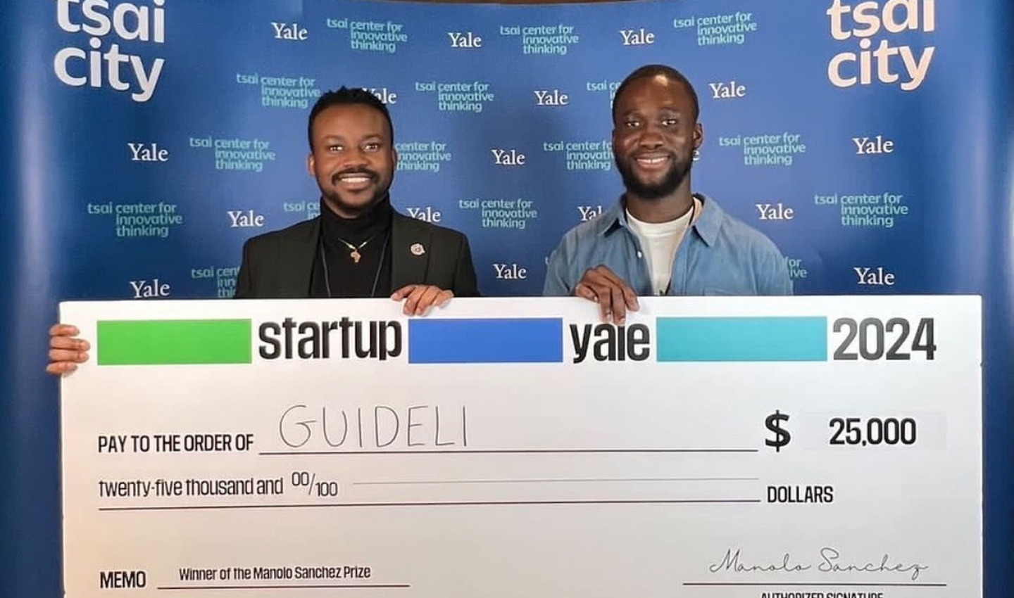 Guideli winners with check